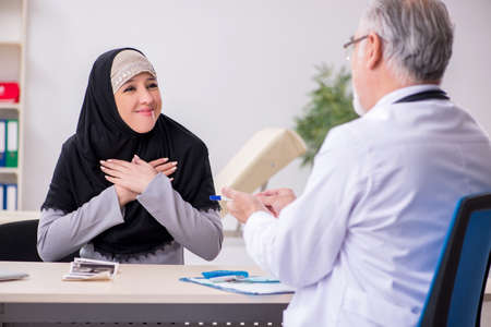 Arab woman visiting experienced doctorの写真素材