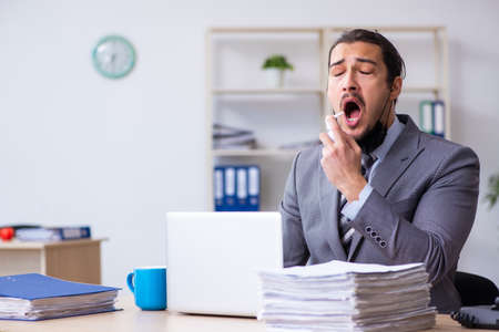 Young male employee in self-quarantine conceptの写真素材