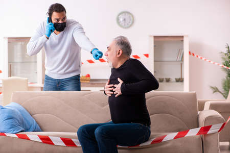 Father and son in coronavirus disease concept at homeの写真素材