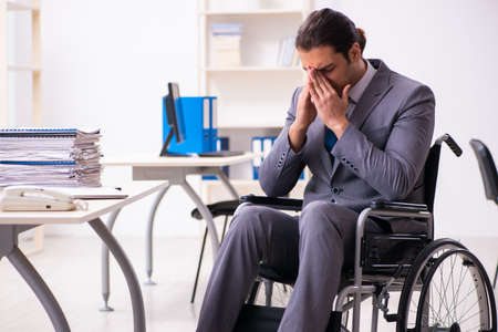Disabled employee in the officeの写真素材