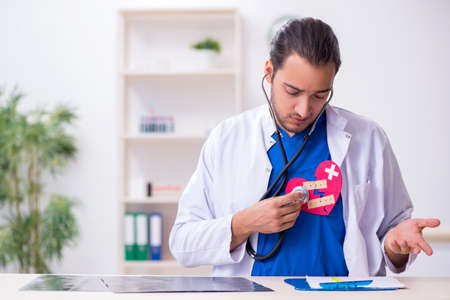 Young male doctor being tired after night shift