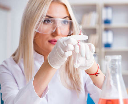 Young female woman doctor in hospital clinic labの写真素材