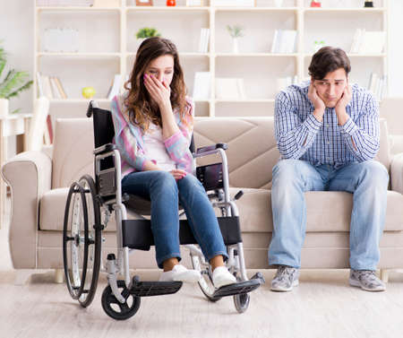 Desperate disabled person on wheelchairの写真素材