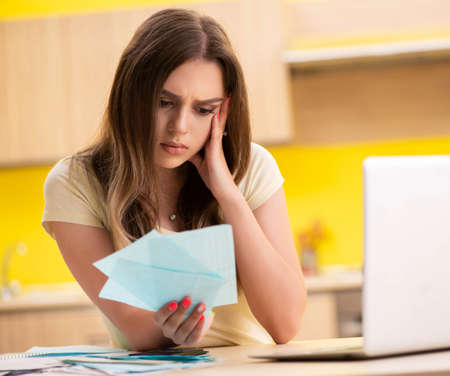 Young woman wife in budget planning concept