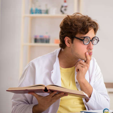 Funny crazy chemist doing experiments and testsの写真素材