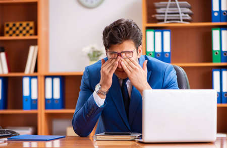 Young employee working in the officeの写真素材