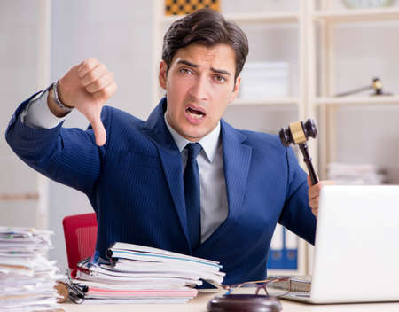 Young handsome judge working in courtの写真素材