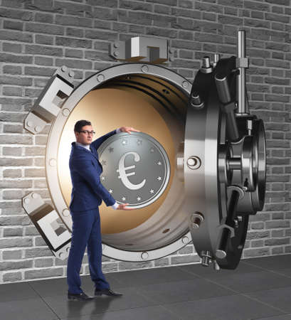 Businessman depositing european euro to bankの写真素材