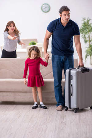 Young couple and their daughter in family conflict conceptの写真素材