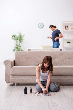 Young woman committing suicide after family conflictの写真素材