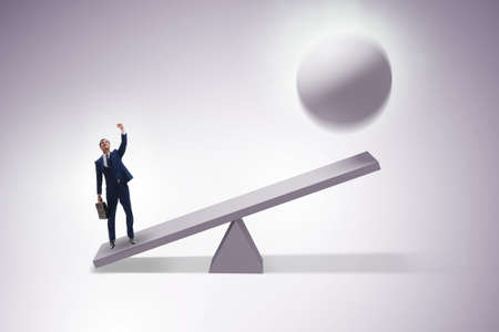 Career progression concept with businessman and seesawの写真素材