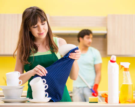 Young couple working at kitchenの写真素材