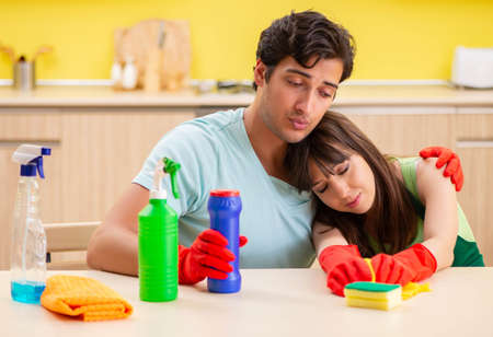 Young couple working at kitchenの写真素材