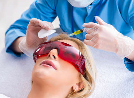 Woman visiting doctor for plastic surgeryの写真素材