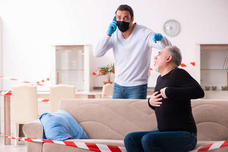 Father and son in coronavirus disease concept at home