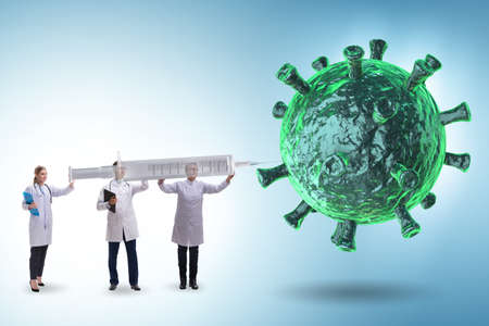 Coronavirus covid-19 vaccine concept with doctors and syringeの写真素材