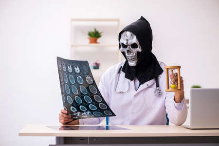 Male devil doctor radiologist working in the clinicの写真素材