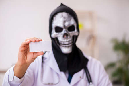 Male devil doctor working in the clinicの写真素材