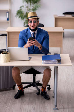 Businessman preparing for trip during pandemicの写真素材