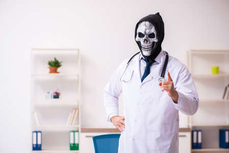 Male devil doctor working in the clinicの写真素材
