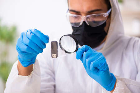 Male expert criminologist working in the lab for evidenceの写真素材