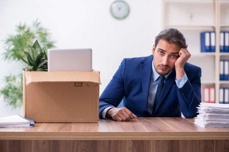 Young man being fired from his workの写真素材