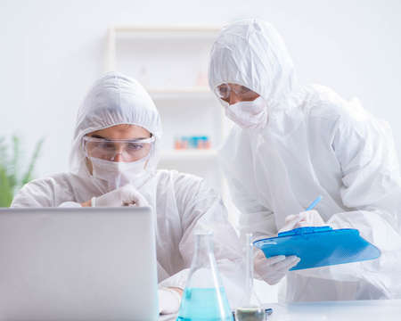 Two scientists working in the chemical labの写真素材