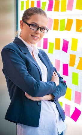 Beautiful female employee with many conflicting priorities