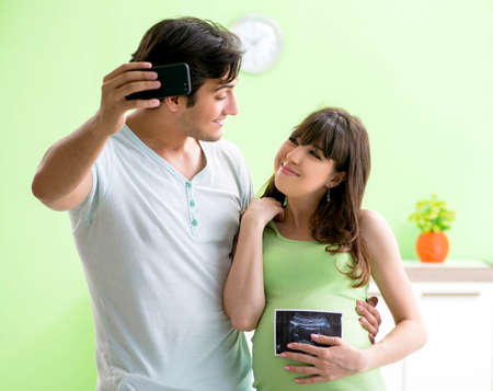 Young family finding out about pregnancyの写真素材