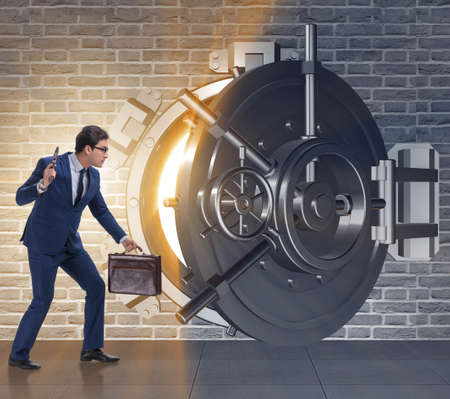 Man with gun stealing money from bankの写真素材
