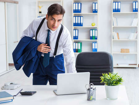 Young stylish businessman working in the officeの写真素材