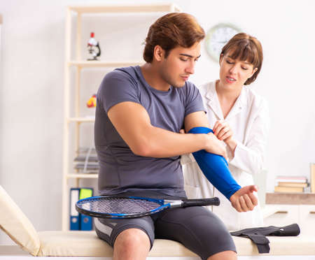 Young tennis player visiting doctor traumatologist