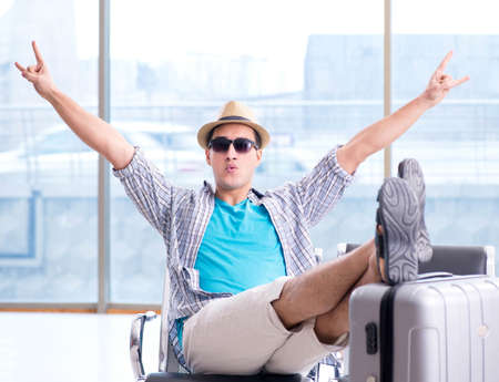 Young man travelling for his summer beach vacationの写真素材