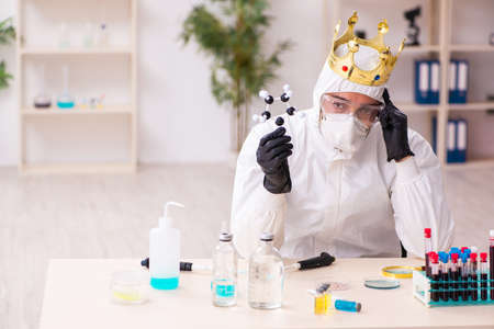 Doctor working in lab in coronavirus COVID-19 conceptの写真素材