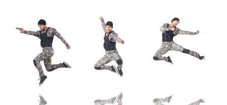 Soldier in camouflage with gun on whiteの写真素材