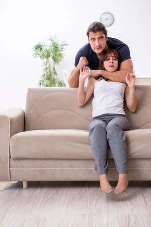 Young couple in domestic violence conceptの写真素材