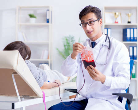 Patient getting blood transfusion in hospital clinicの写真素材