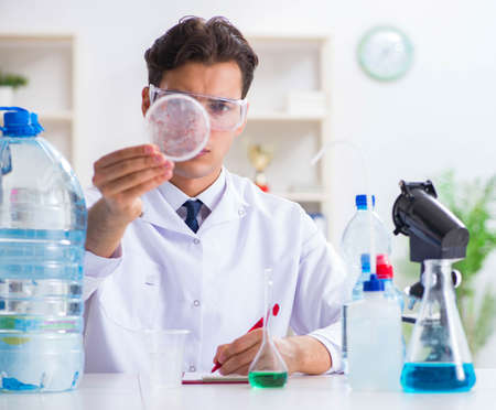 The lab assistant testing water quality