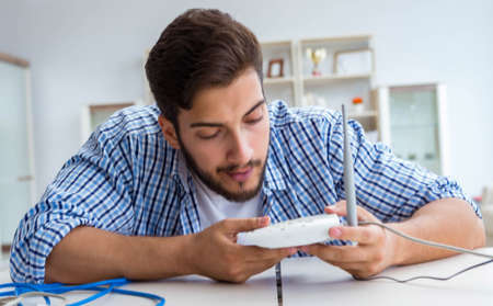 Frustrated young man due to weak internet receptionの写真素材