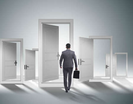 Businessman facing many business opportunitiesの写真素材