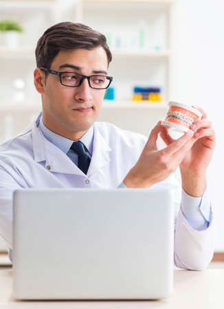 Young dentist working in the dentistry hospitalの写真素材
