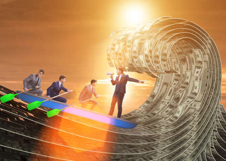 The businessman leading his team through dollar seaの写真素材