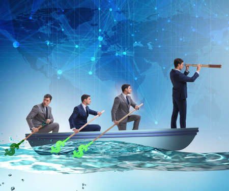 Team of businessmen in teamwork concept with boatの写真素材