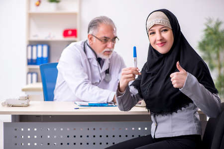 Arab woman visiting experienced doctorの写真素材