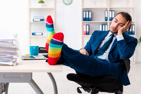 Young male businessman working in the officeの写真素材