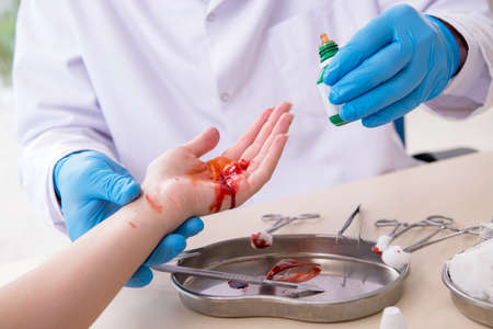 Hand injured woman visiting doctor