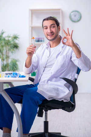 Young male chemist working in the labの写真素材