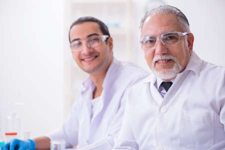 Two chemists working in the lab