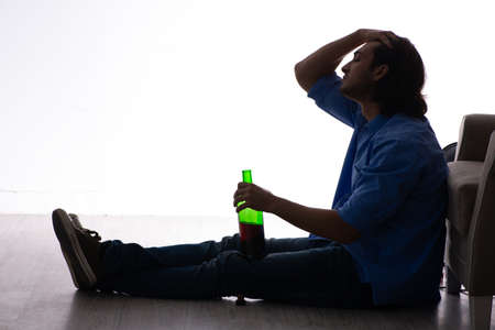 Young man suffering from alcoholism
