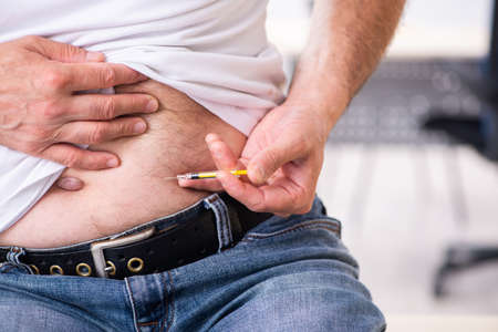 Patient suffering from diabetes visiting doctorの写真素材